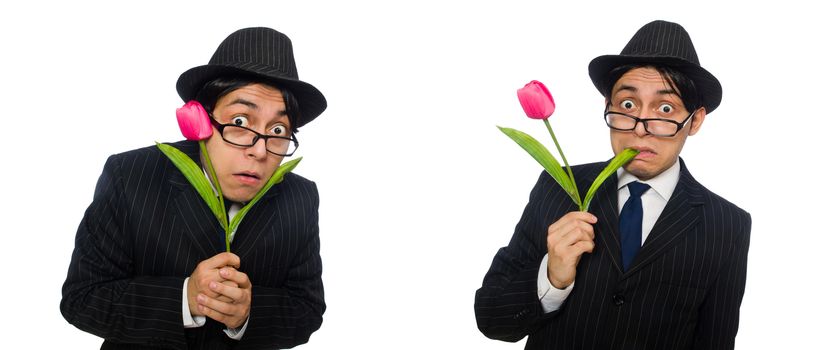 Young man in black costume with flower isolated on white