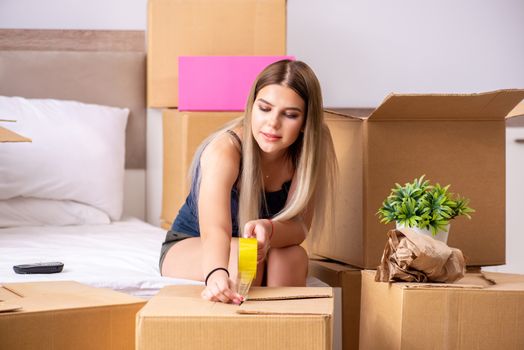 Young woman moving to new place