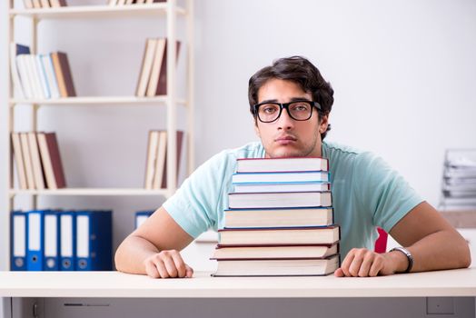 Young handsome student preparing for school exams