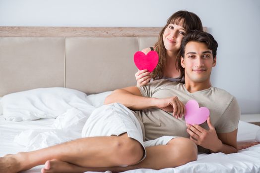 Happy couple in the bed