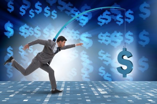 Businessman chasing money on fishing rod