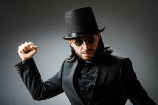 Vintage concept with man wearing black top hat