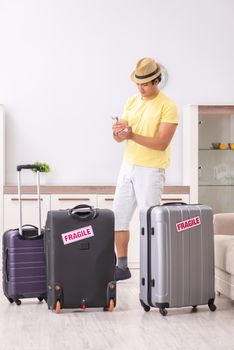 Man going on vacation with fragile suitcases