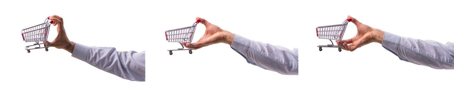 Hand holding shopping cart isolated on white