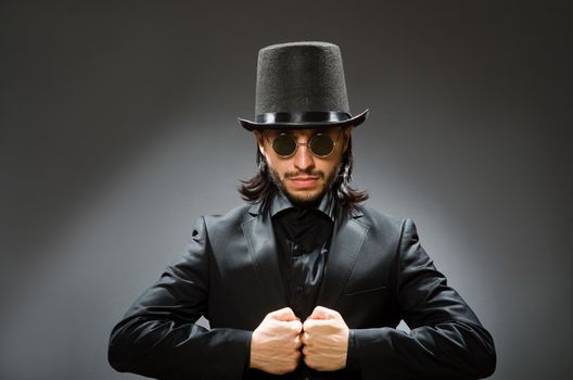 Vintage concept with man wearing black top hat