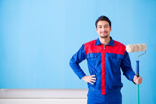 Young painter doing renovation at home 
