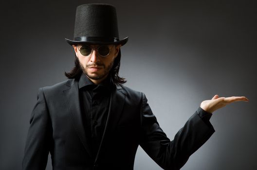 Vintage concept with man wearing black top hat