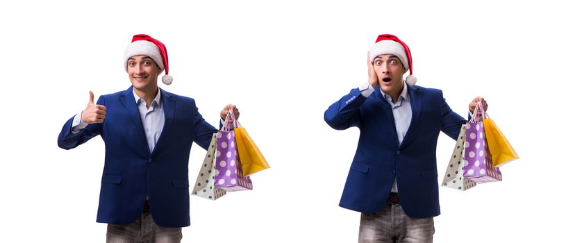 Young man with bags after christmas shopping on white background 
