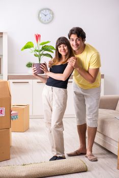 Young pair moving to new flat with fragile things 