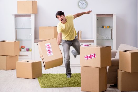 Man moving house and relocating with fragile items