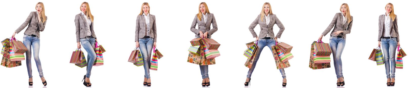 Beautiful woman with shopping bags isolated on white