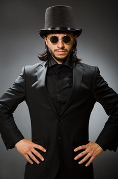 Vintage concept with man wearing black top hat