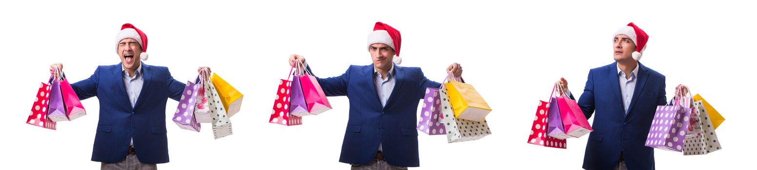 Young man with bags after christmas shopping on white background 