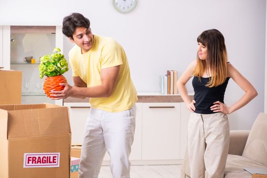 Young pair moving to new flat with fragile things 