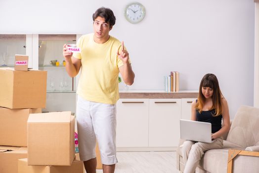 Young pair moving to new flat with fragile things 