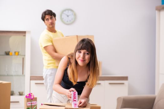 Young pair moving to new flat with fragile things 