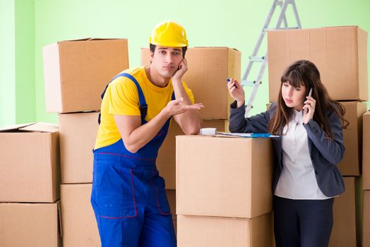 Woman boss and man contractor working with boxes delivery