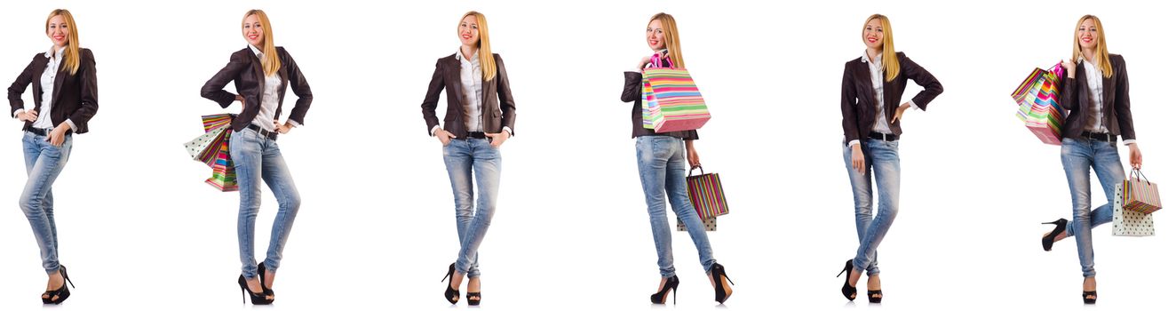 Beautiful woman with shopping bags isolated on white