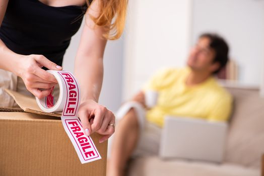 Young pair moving to new flat with fragile things 