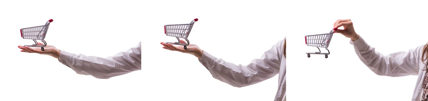 Hand holding shopping cart isolated on white