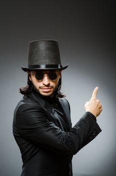 Vintage concept with man wearing black top hat