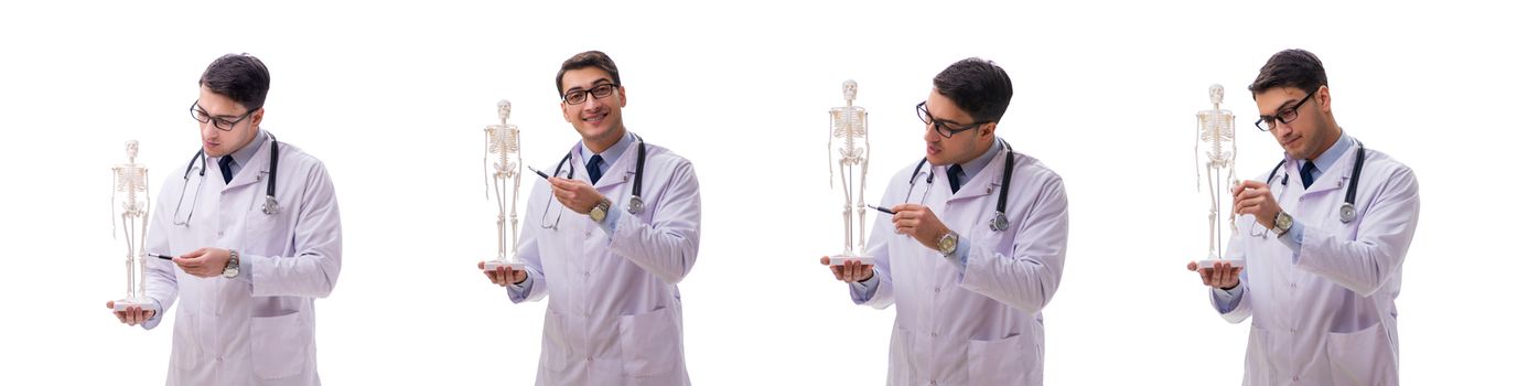 Young male doctor with skeleton isolated on white