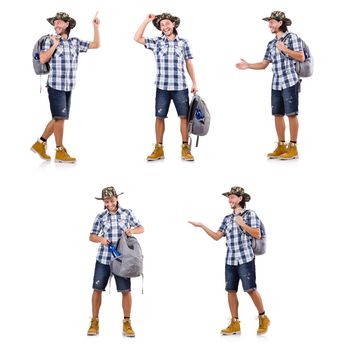 Young traveller with backpack pointing isolated on white