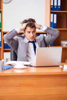 Young employee working in the office