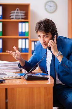 Young employee working in the office