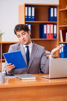 Young employee working in the office