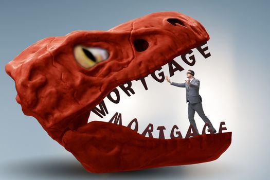 Businessman in the jaws of debt and loan