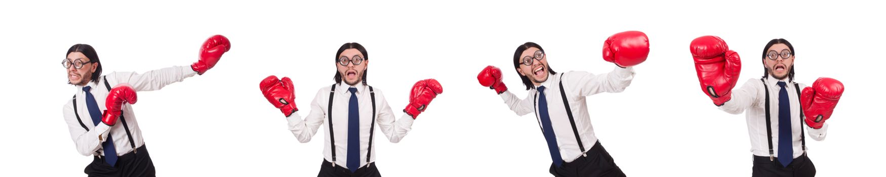 Funny young  businessman with boxing gloves isolated on white