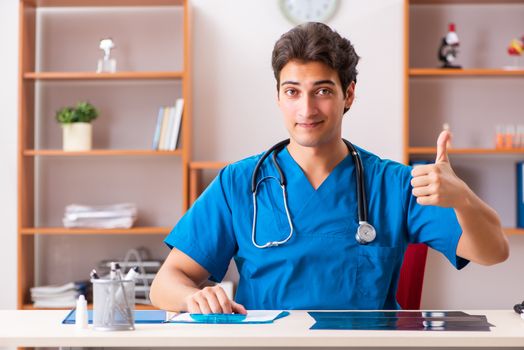 Young handsome doctor radiologyst working in clinic 