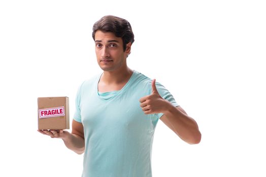 Young handsome man with fragile box ordered from Internet 