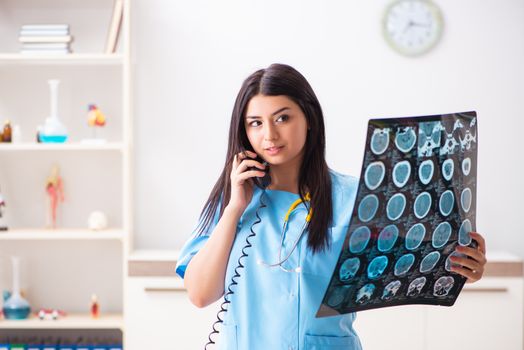 Young beautiful female doctor working in the clinic 