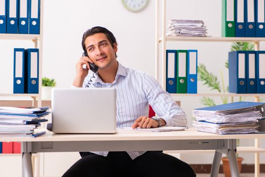 Young employee sitting at the office 
