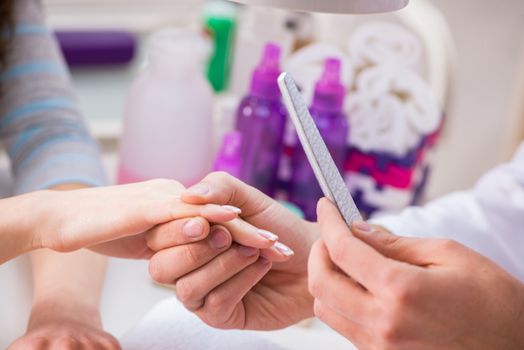 Hands during manicure care session