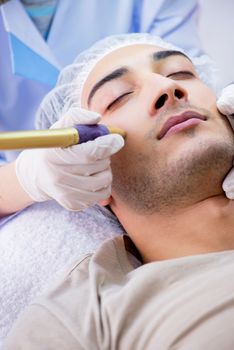 Man visiting dermatologyst for laser scar removal  