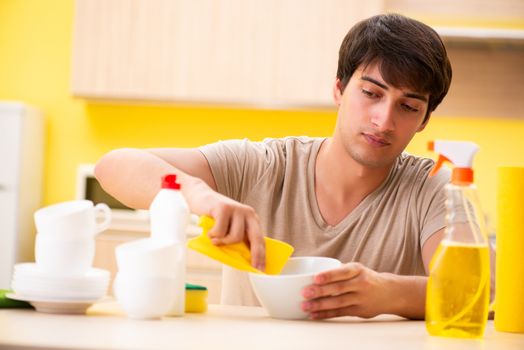 Man washing dishes at home