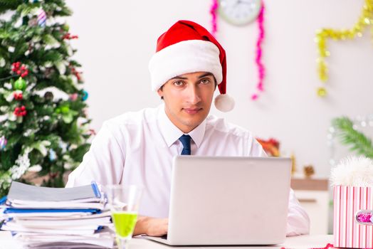 Employee businessman celebrating christmas in office