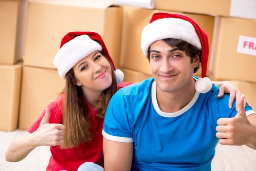 Young family celebrating christmas in new home