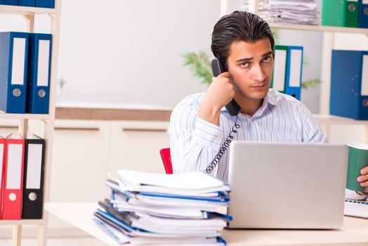 Young employee sitting at the office 