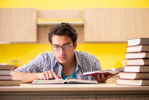 Student preparing for exam sitting at the kitchen 