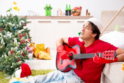 Young man drunk at home after christmas party