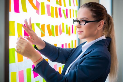 Beautiful female employee with many conflicting priorities 