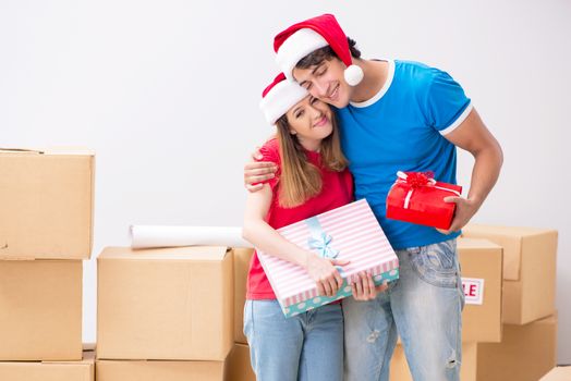 Young family celebrating christmas in new home
