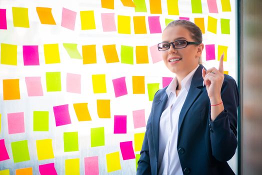 Beautiful female employee with many conflicting priorities 