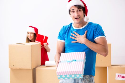 Young family celebrating christmas in new home