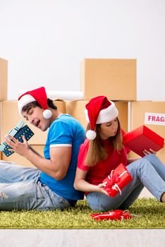 Young family celebrating christmas in new home