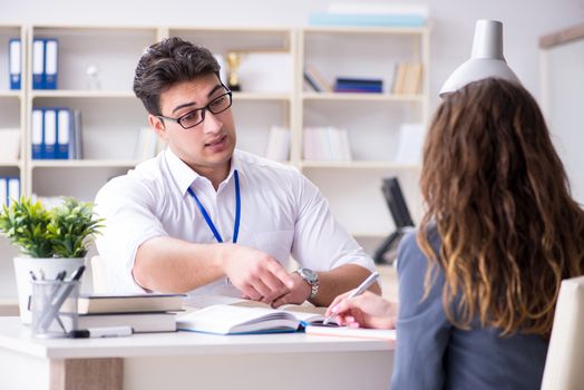 Sales assistant discussing transaction with customer